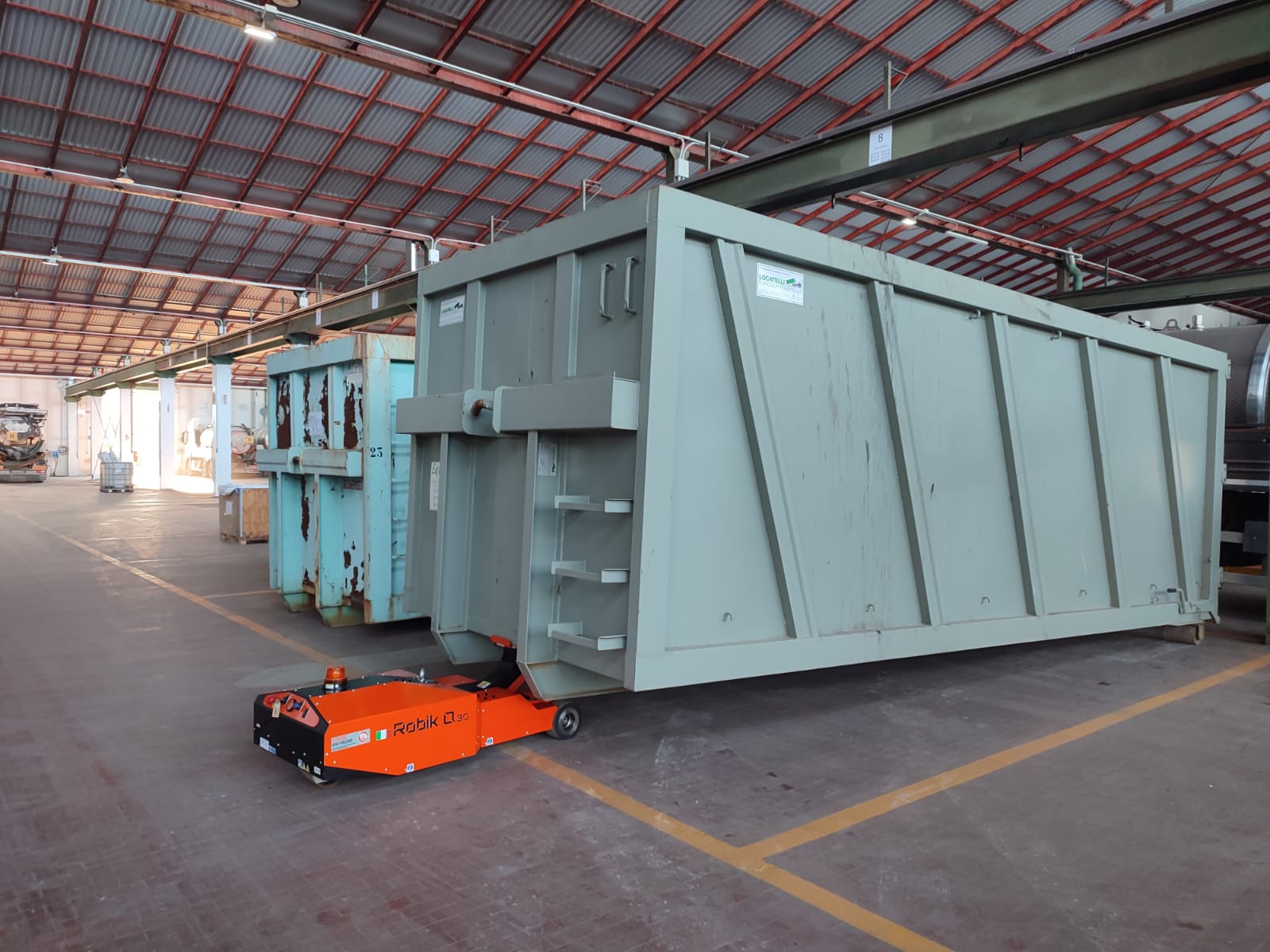 ENVIRONMENTAL SECTOR Robik Q30 tows skip bin for waste